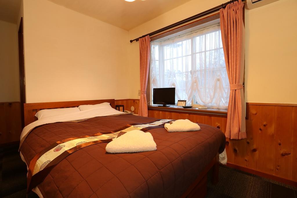 Bed and Breakfast Alpine Wind Хакуба-Мура Номер фото